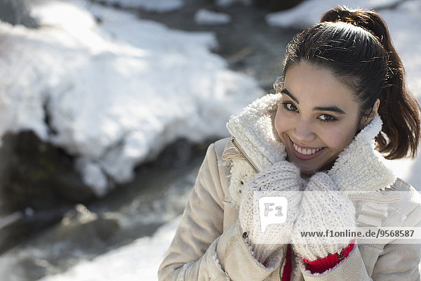 Portrait of smiling woman in snow