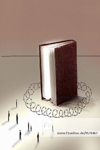 Menschen werden von einem großen Buch durch Stacheldraht getrennt