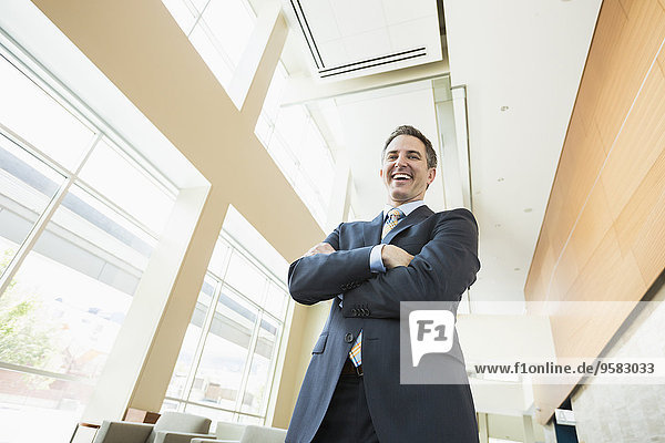 Low angle view of Caucasian businessman standing in office
