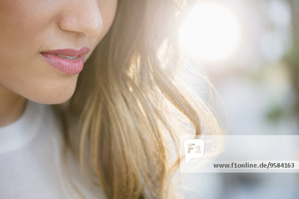 Close up of lips and hair of Hispanic woman