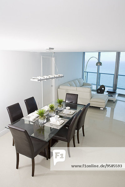 Dining room and sofa in modern apartment