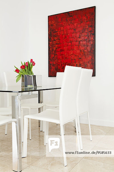 Table  chairs and wall art in modern dining room