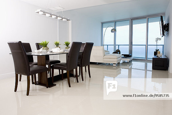 Dining table and sofas in modern living space