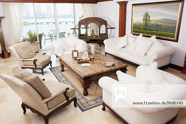 High angle view of sofas and armchairs in ornate living room