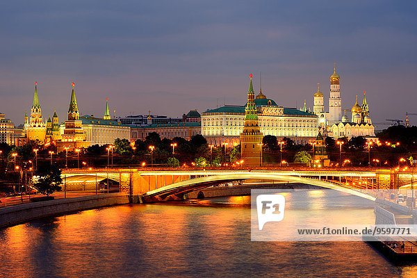 View of Kremlin towers and the Bolshoy Kamenny bridge over Moskva river at night  Moscow  Russia