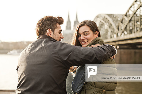 Germany  Cologne  happy young couple on city tour