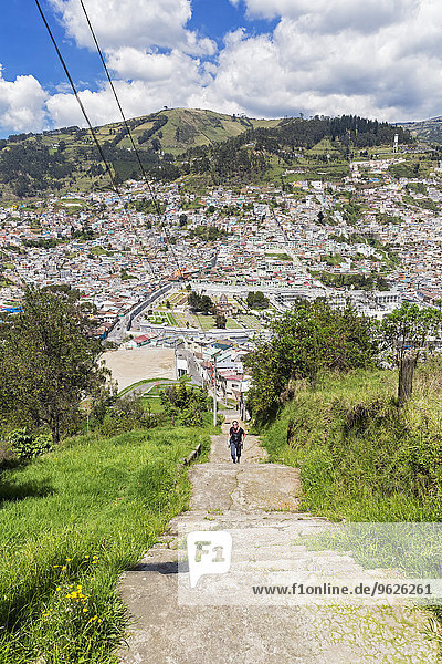 Ecuador  Quito  cityscape with tourist walking towards El Panecillo