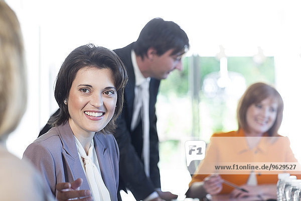 Smiling woman in a business meeting