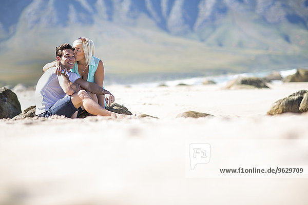 Happy young couple on the beach