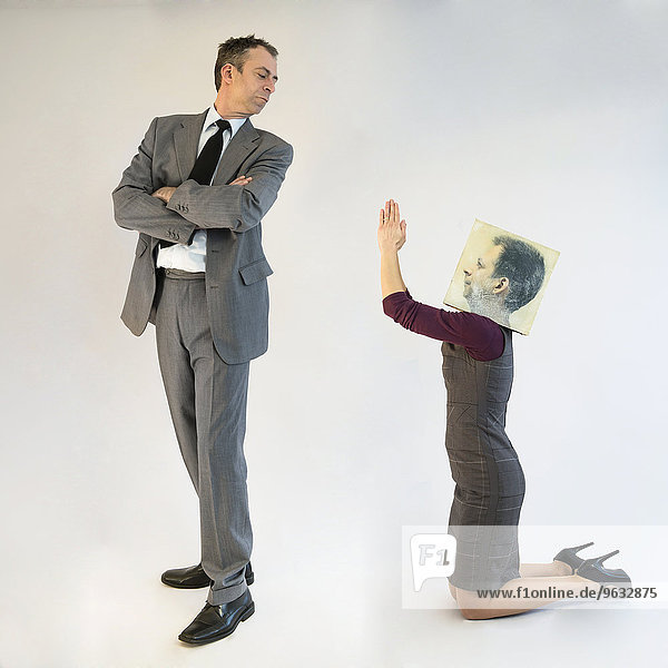 Businesswoman with mask pleading to businessman