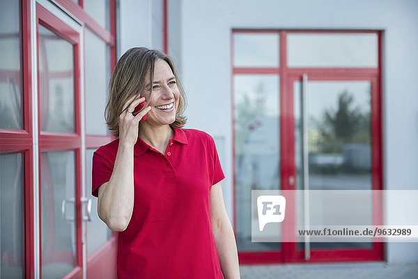 Businesswoman talking on smart phone  smiling