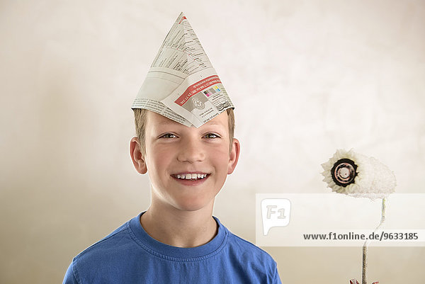 Portrait boy paper hat painting decorating