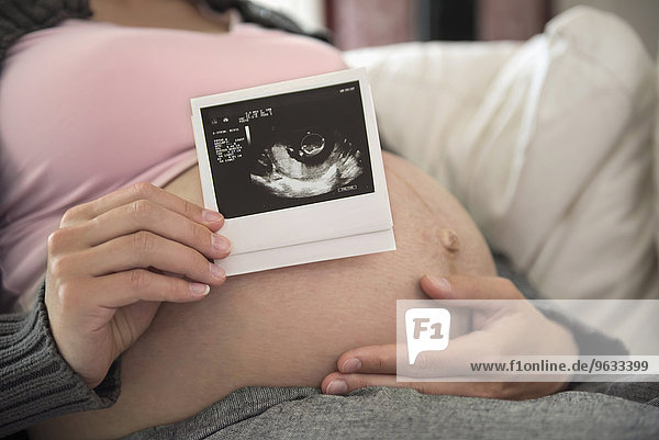 Close-up pregnant woman ultrasonic sound photo