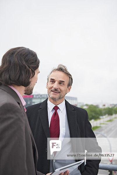 Portrait businessmen talking planning dealings