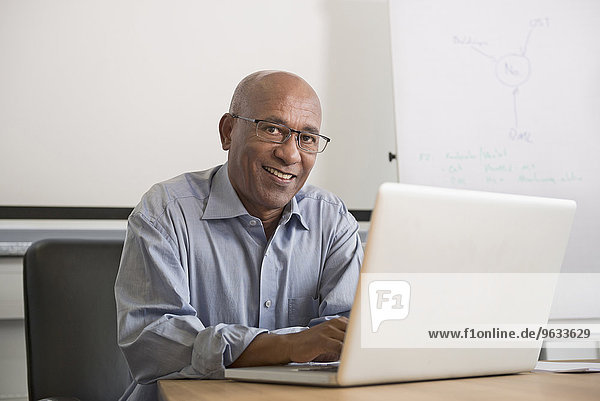 Portrait African man office laptop computer
