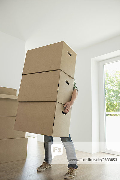 Pile stack boxes man hidden carrying heavy