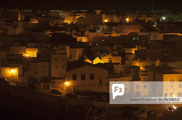 View of whitewashed village houses at night