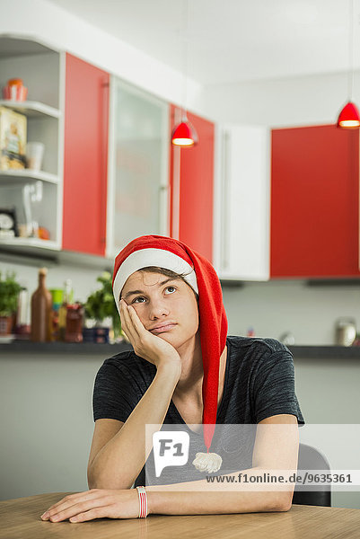 Bored young man with Santa hat