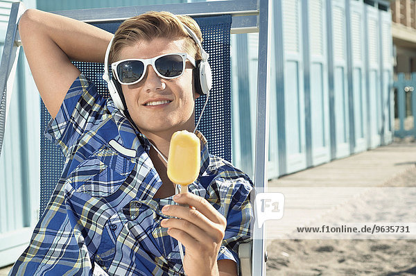 Teenager boy summer holiday sunglasses ice cream