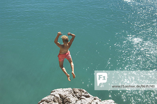 Teenager water cliff sunshine summer holiday jump