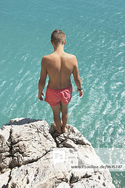 Waiting preparing teenager boy cliff diving