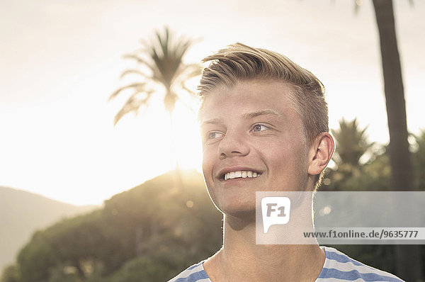Sunset portrait young teenager smiling holiday