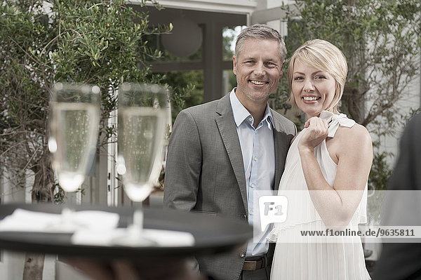 Attractive couple garden date Rendezvous Champagne