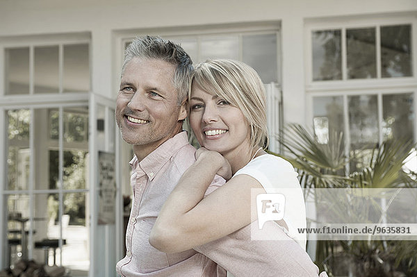 Couple married hugging garden portrait smiling