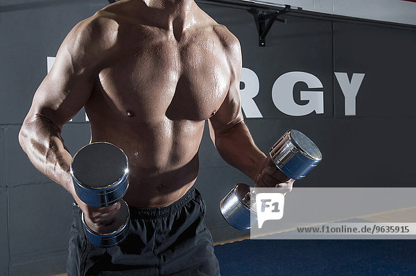 Detail close up muscular man weight training