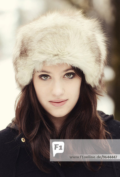 Young woman wearing a fur hat in winter  portrait