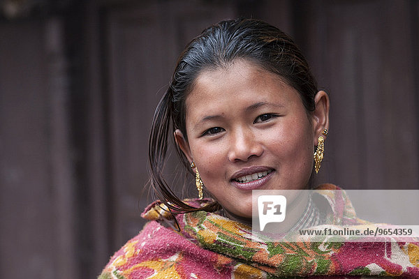 Young Nepali woman with earrings  portrait  Bhaktapur  Nepal  Asia
