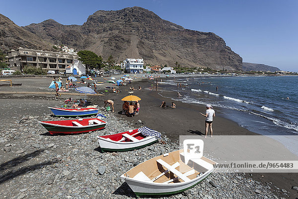 Wooden boats on the beach  Playa La Calera  Tequergenche at the back  Valle Gran Rey  La Gomera  Canary Islands  Spain  Europe