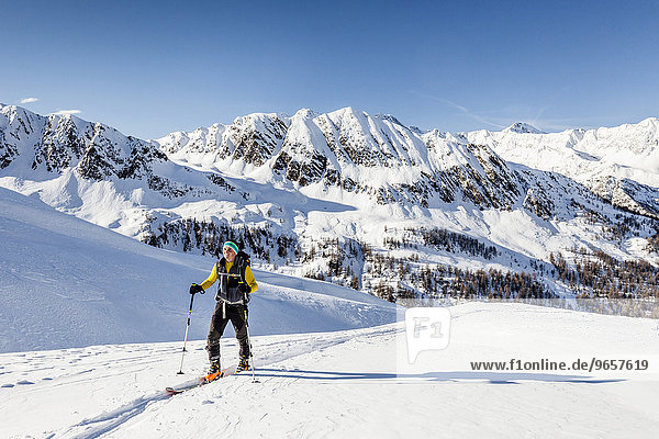 Ski tourer during the ascent of Mt Zermaidjoch  at the back Mt Pfauses and Mt Ganderberg  Moos in Passeier  Passeiertal  Val Passiria  Meraner Land  Meran region  Trentino-Alto Adige  South Tyrol  Italy  Europe