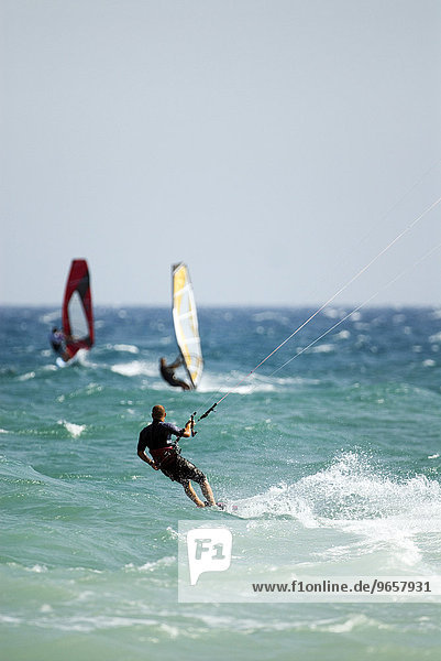 Kitesurfer and windsurfers  Mediterranean coast  Spain  Europe