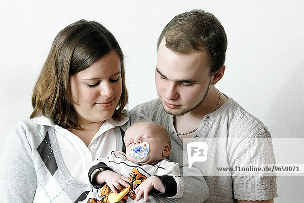Nineteen-year-old parents and their baby boy