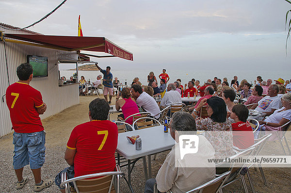 Guests watching the World Cup final in a beach restaurant near Altea  Costa Blanca  Alicante  Spain  Europe