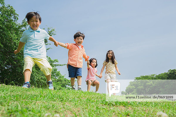Japanese kids playing in a park