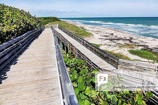 Florida  Riviera Beach  North Palm Beach  John D. MacArthur Beach State Park  boardwalk  handicapped wheelchair ramp  water  nature  surf  Atlantic Ocean  beach  sand.