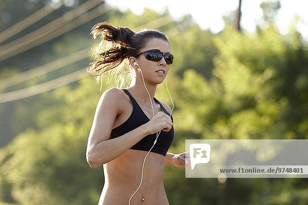 Caucasian woman running outdoors