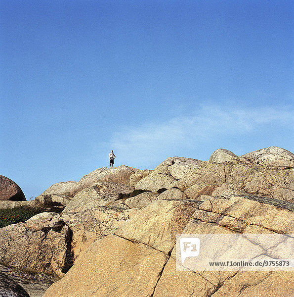 Person standing on rock