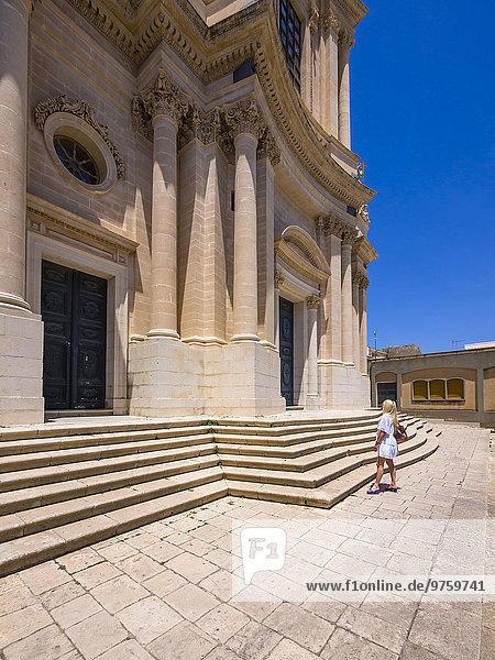 Italy  Sicily  Modica  Woman looking at San Giovanni church  UNESCO World heritage site
