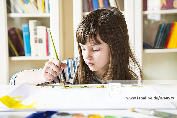 Girl painting with watercolours