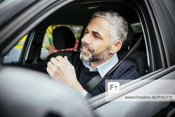 Annoyed man driving car