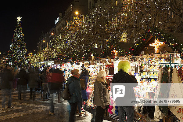 Christmas Market and Christmas tree at Wenceslas Square during Advent evening  Nove Meso  Prague  Czech Republic  Europe