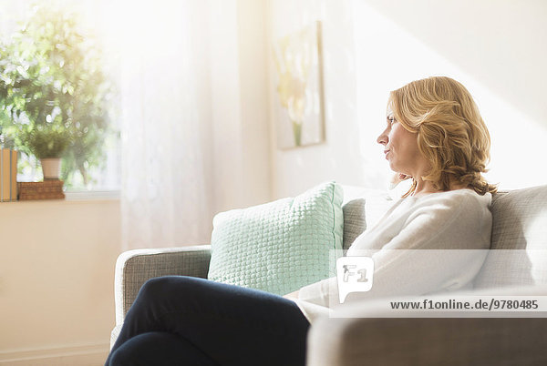 Woman sitting on sofa