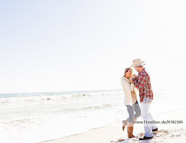 Loving couple dancing on beach