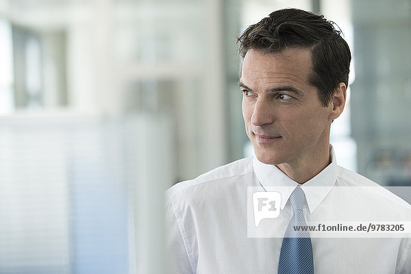 Businessman looking away in thought  portrait