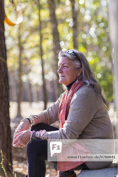 Older Caucasian woman sitting outdoors