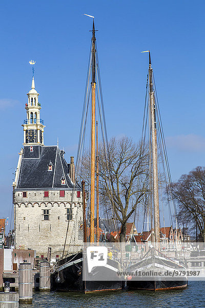 Historic Port Building De Hoofdtoren  flat-bottomed sailing boats in Binnenhaven  Ijsselsea  Hoorn  North Holland  The Netherlands  Europe