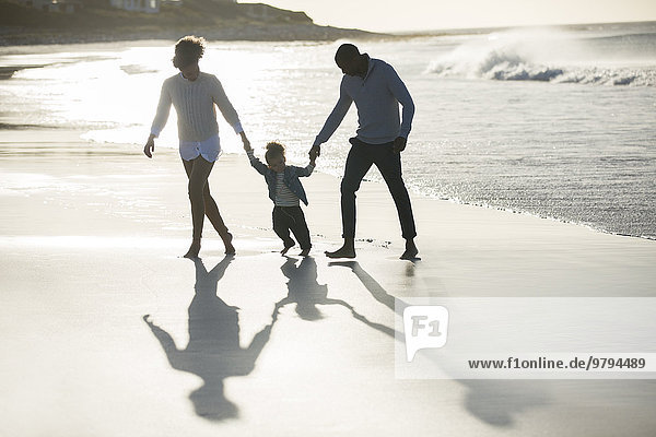 Happy family having fun on beach